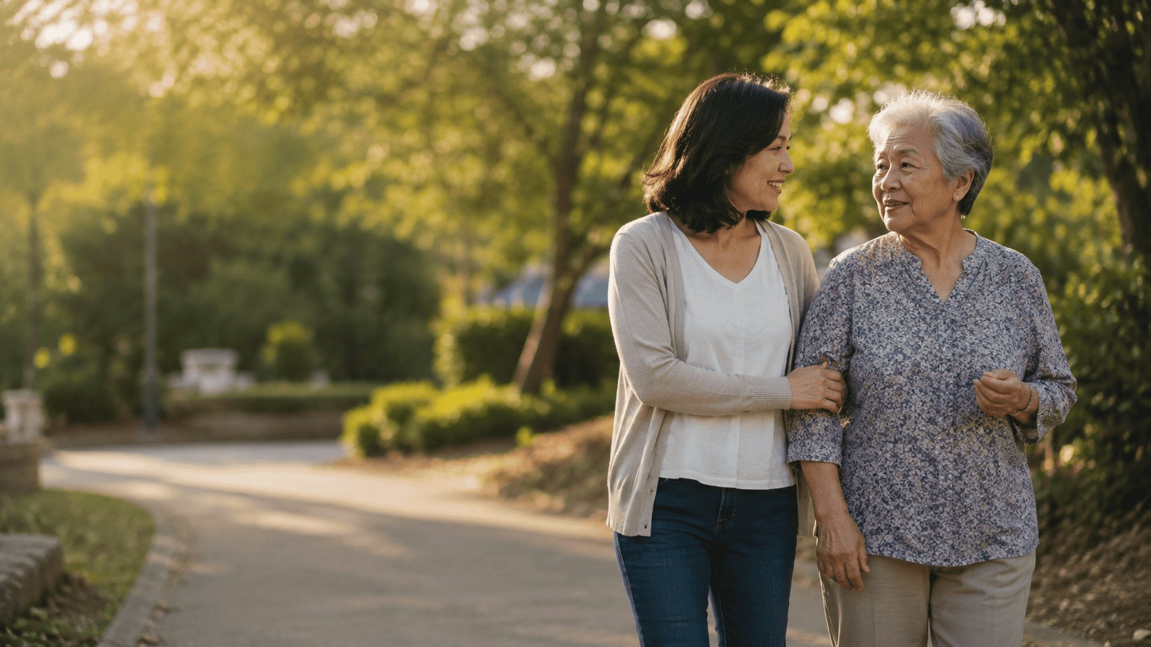 Woman walking with elderly lady in park, promoting awareness of blood disorders.